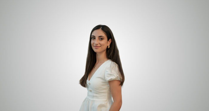 Denise Di Luigi, Charter Manager at Hill Robinson, photographed against a light grey background.